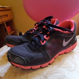 Pink nike athletic shoes